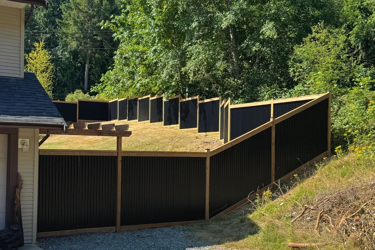 Cedar and metal privacy fence built by Tonella Contracting in Nanaimo, Vancouver Island