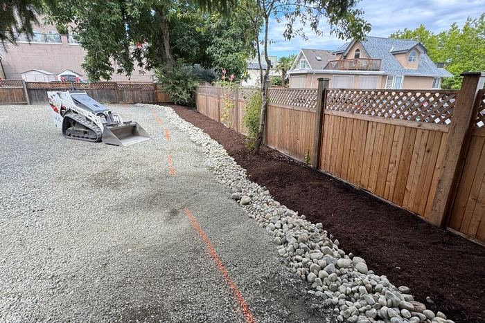 Site grading and drainage rock work by Tonella Contracting